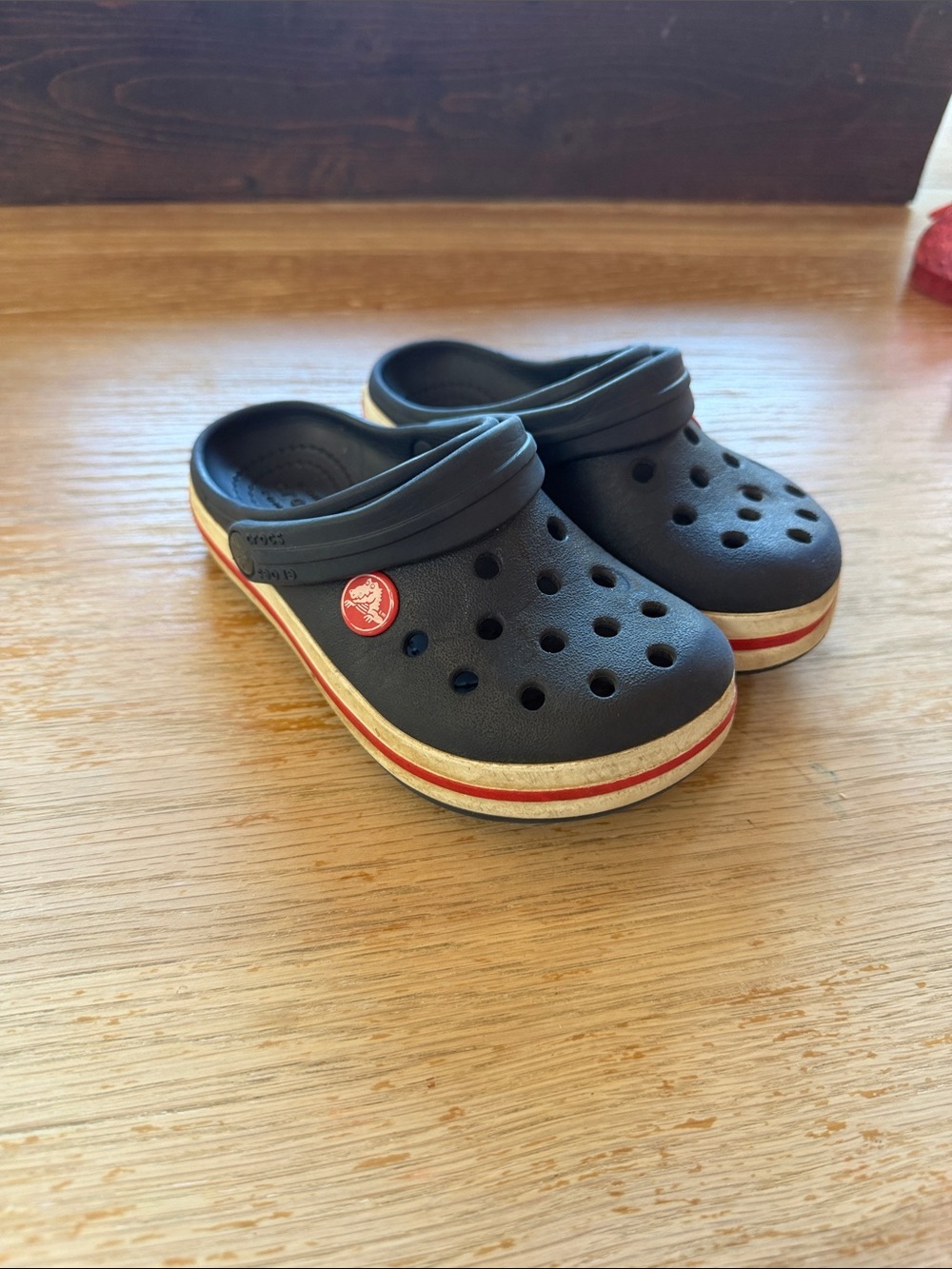 CROCS Kids Navy Clogs with Red Stripe Accent